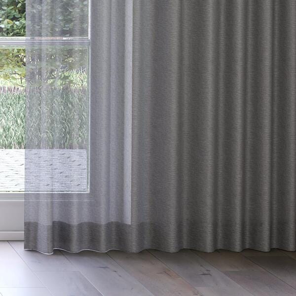 The hem of Clarke smoke see-through sheer curtains.
