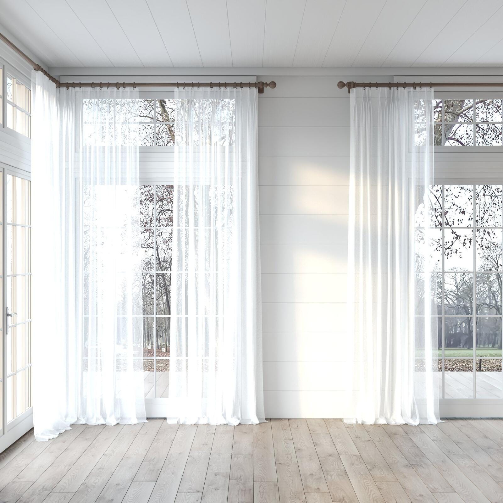 Custom curtains & blinds displayed in an open living area of a home.