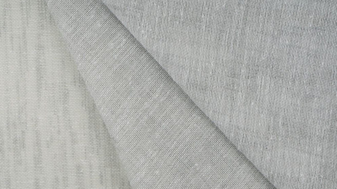 Close-up of Flow mink see-through sheer curtain fabric.