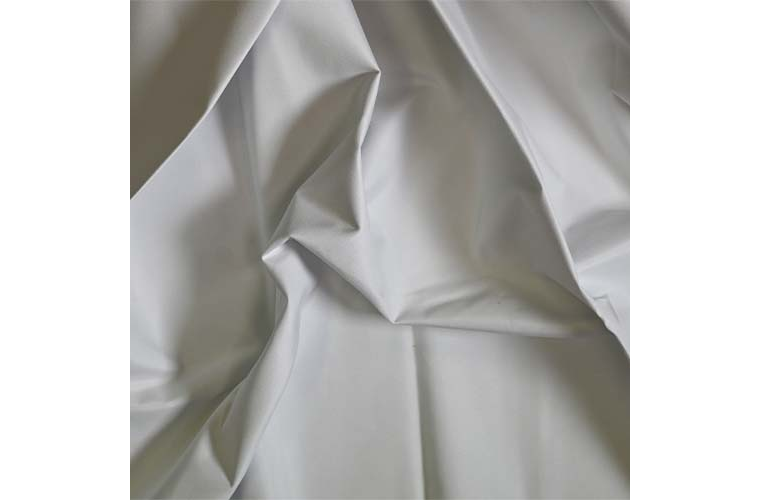Close-up of warm cream Lining curtain fabric.