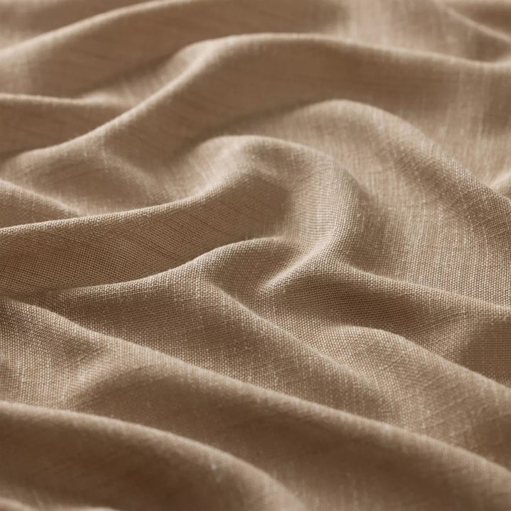 Close-up of Villa golddust semi-transparent curtain fabric.